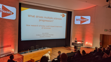 Lecture theatre with speaker Anna Williams giving STOP MS talk