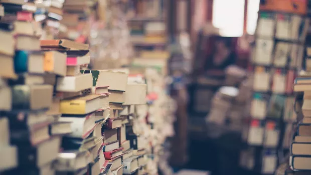 Hundreds of second hand books stacked up in an overcrowded second hand book shop