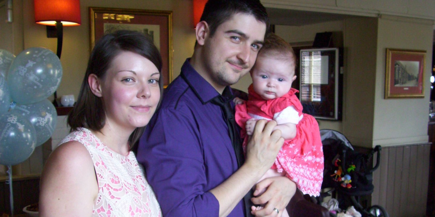 Dave with his wife and their first baby