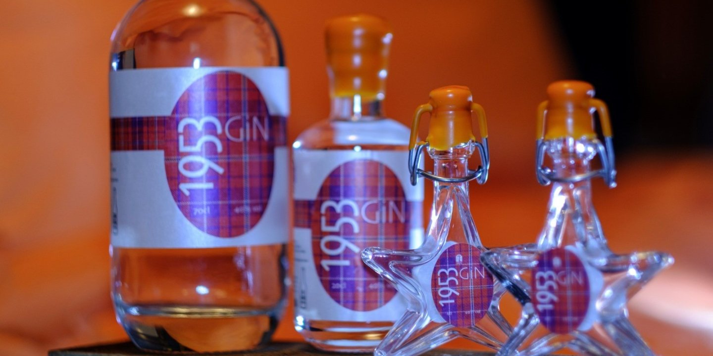 The photo shows four bottles of MS Society Selkirk Gin in different sizes