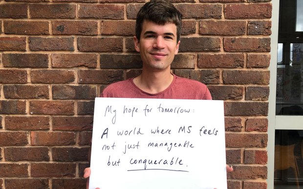 a photo of Ivo Graham holding a sign
