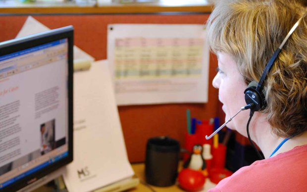 MS Helpline volunteer using a headset