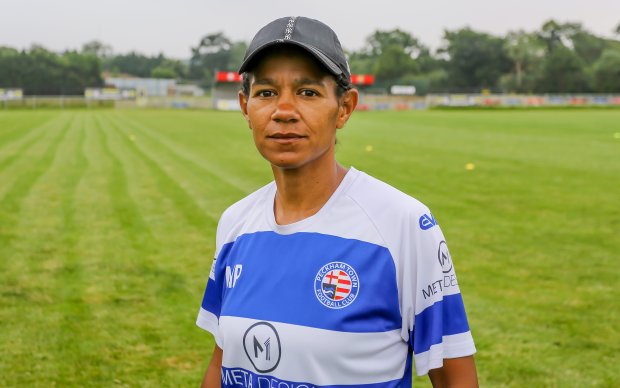 Photo of Mary Phillip in a blue and white football jersey