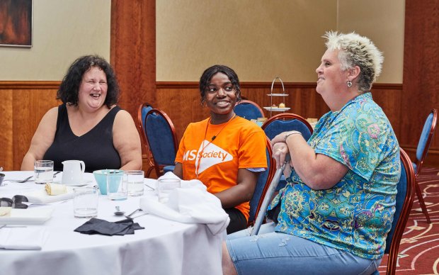 Volunteers having a discussion at a local MS group meeting