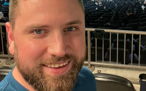 Headshot of a man at a sporting event
