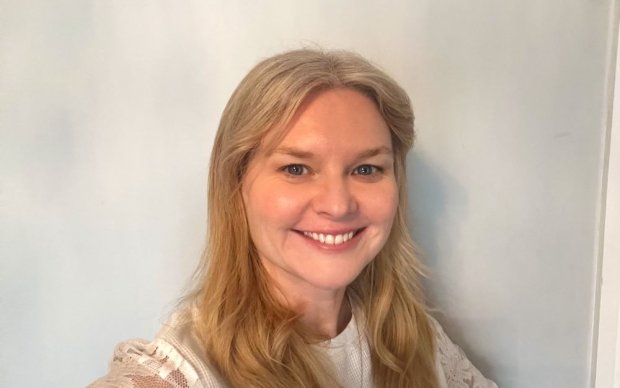 A headshot of Hayley Hammond, who has long blonde hair and is smiling