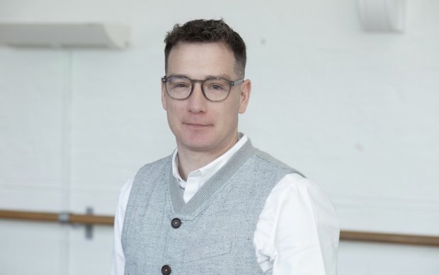 Picture of a man in front of a white background