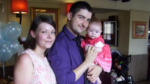 Dave with his wife and their first baby