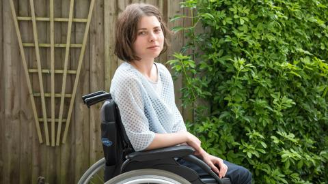 a photo of Edith in garden with wheelchair