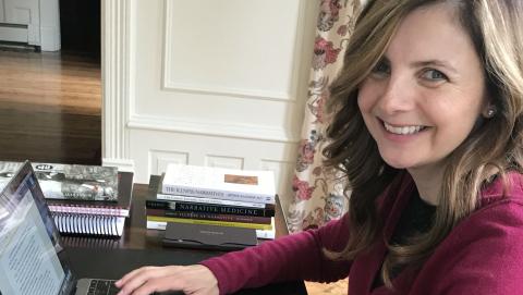 Gillian writing at her laptop