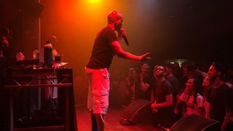 Masta Ace on stage at the Jazz Cafe under orange stage lights