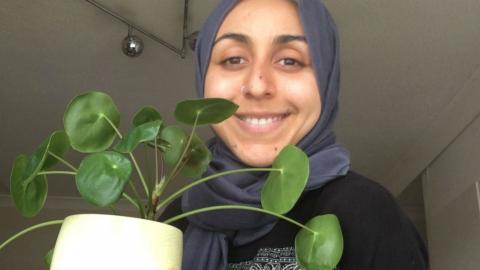 Noor holds one of her pot plants