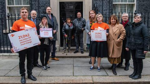 MS Society campaigners handing in the PIP Fails petition on the steps of Number 10 Downing Streeet