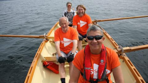Rowing the Minch crew rowing their boat wearing MS Society t-shirts