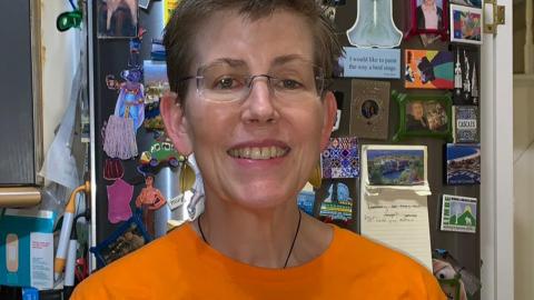 Susan smiling to camera wearing her MS Walk T shirt