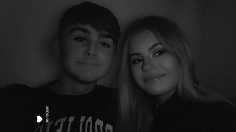 Connor and Lucy together in a black and white photo