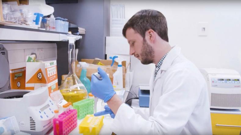 MS researcher at work in lab, using a pipette