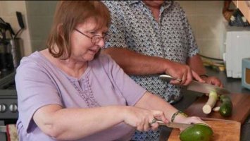 a photo of a Couple cooking in the  kitchen