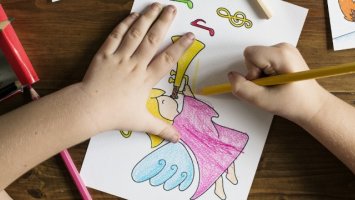 Childs hands drawing a picture