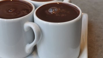 image shows mugs of hot chocolate