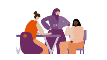 3 people work together around a table