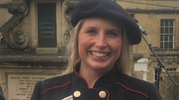 Photo shows Stephanie Millward smiling, in her official dress as Deputy Lieutenant for Wiltshire.