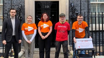 People with MS and MS Society staff outside 10 Downing Street with a petition