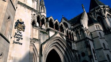 Royal Courts of Justice against a blue sky