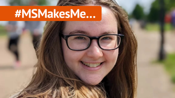 Jenni is smiling to the camera she is white with long brown hair and wears glasses. A banner with #MSMakesMe runs above her photo