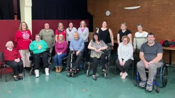 Members of MS Society Hinckley and DIstrict Group gathered round smiling