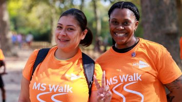 Two MS Society fundraisers wearing MS Walk t-shirts