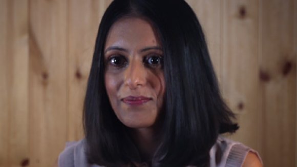Donna wearing a purple top looking to camera