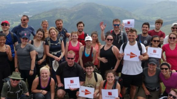 Group of REaD Group employees fundraising for the MS Society by taking on the 10in10 challenge. Pictured on top of a mountain.