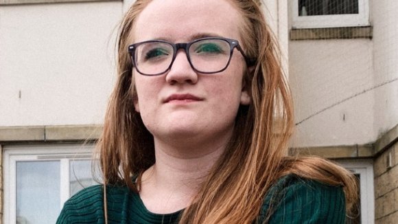 Fiona wearing glasses and a green top