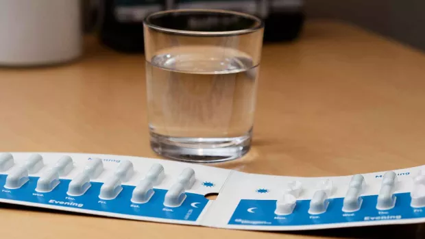 glass of water and pills