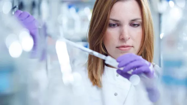 A photo of a scientist in a lab coat 
