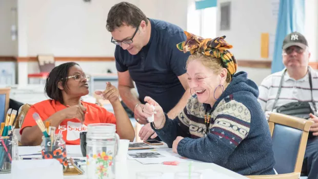 A photo of a group of people enjoying crafts