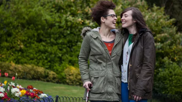 a photo of a couple walking in the park