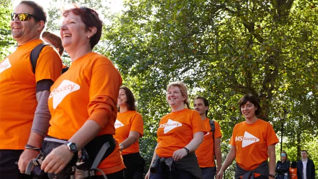 Photo: a group of MS fundraisers in a walking event with smiling faces