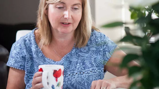 A photo of a woman drinking tea