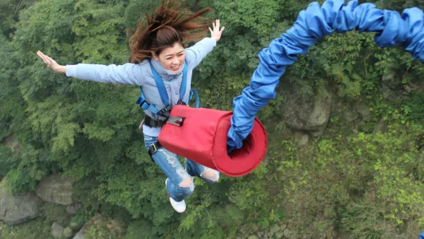 a woman bungee jumping