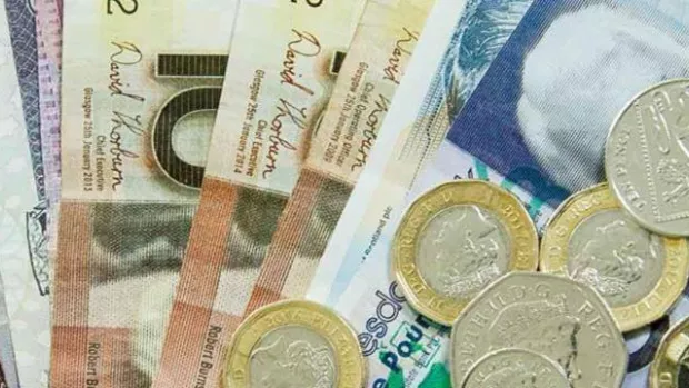 A photo showing Euro coins and notes