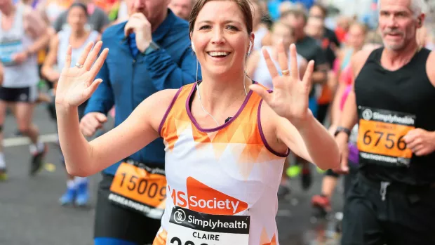 a woman running a fun run