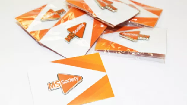 a photo of MS In celebration pin badges