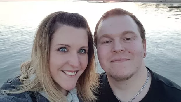 Photo: James who has MS and his wife Katie at sunset by the sea