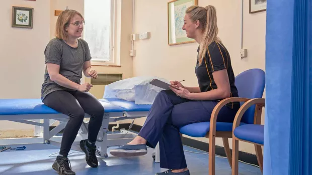 Photo: Woman with MS doing physiotherapy with her physiotherapist