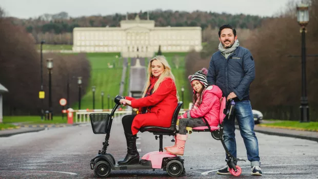 A family outside the Northern Ireland parliament