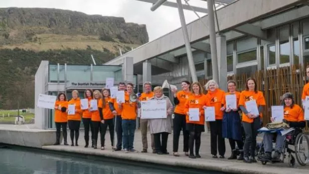 A group of MS campaigners outside the Scottish Parliament