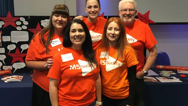 A group of MS Society Scotland staff wearing MS Society t-shirts at an event