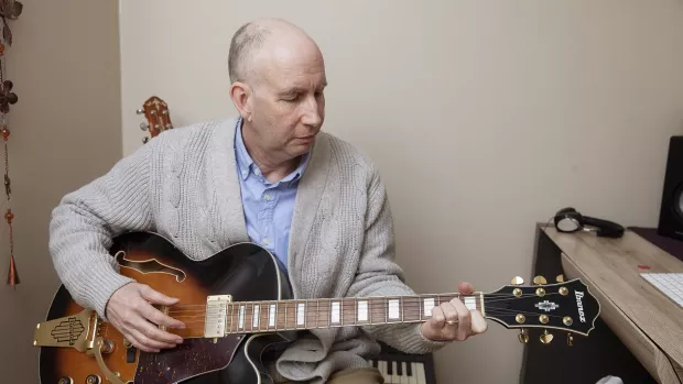 Trevor playing the guitar